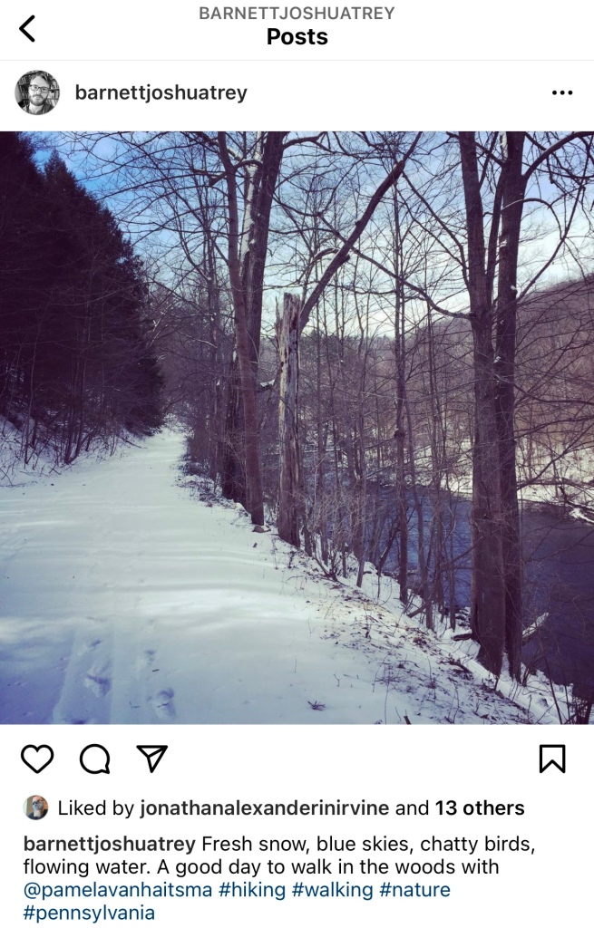 Screenshot of Instagram post. Picture of snowy trail, trees, a river.